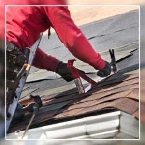 Roofer Replacing Shingles